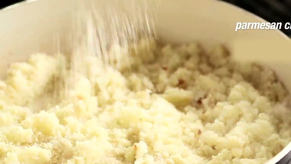 Parmesan cheese added to cauliflower rice