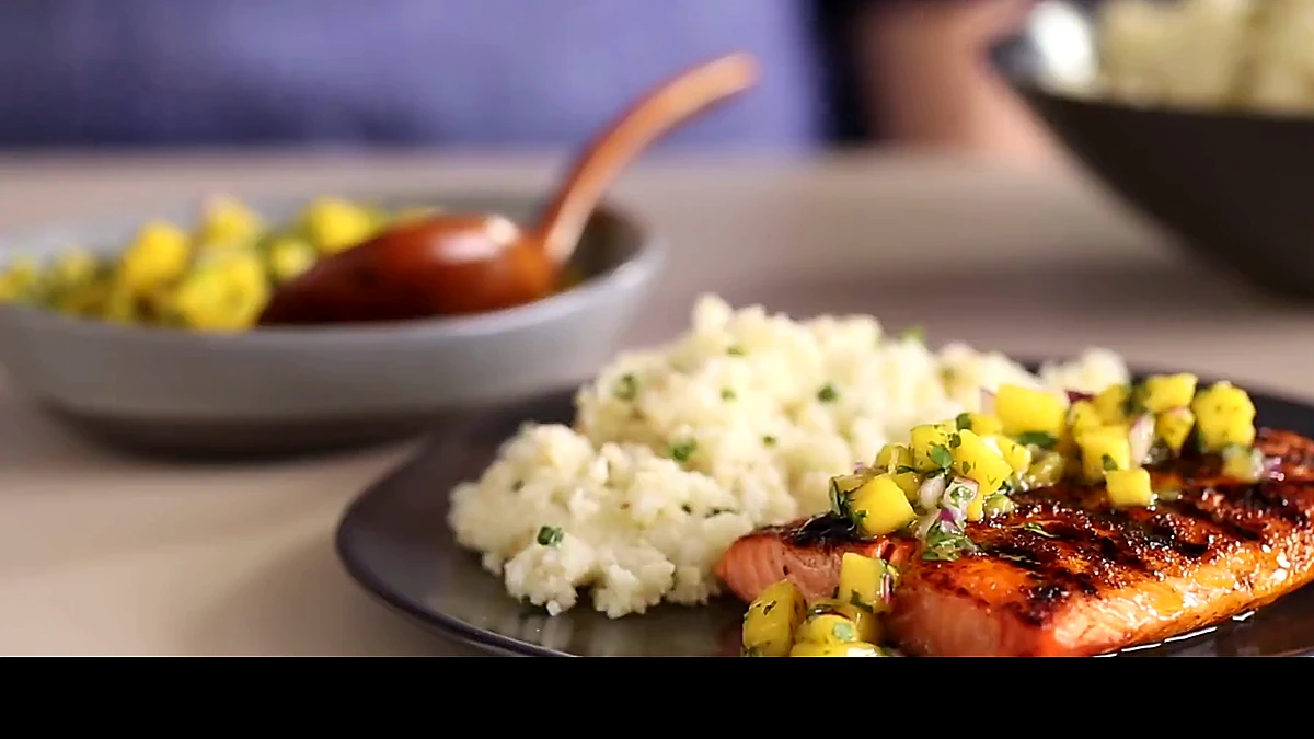 Spiced salmon plated with cauliflower rice