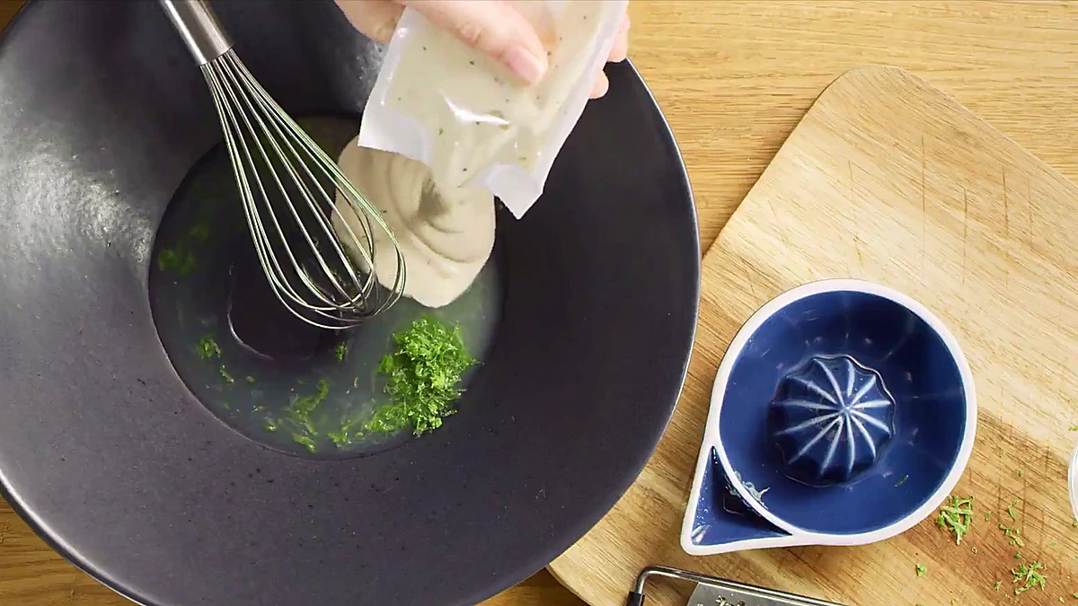 Caesar dressing added to lime juice and zest