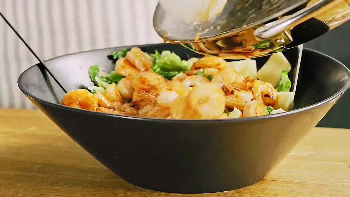 Glazed shrimp added over the naan salad