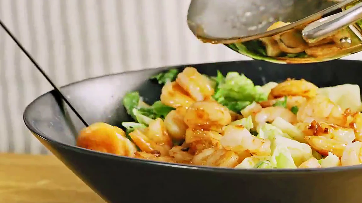 Close view of glazed shrimp added to panzanella