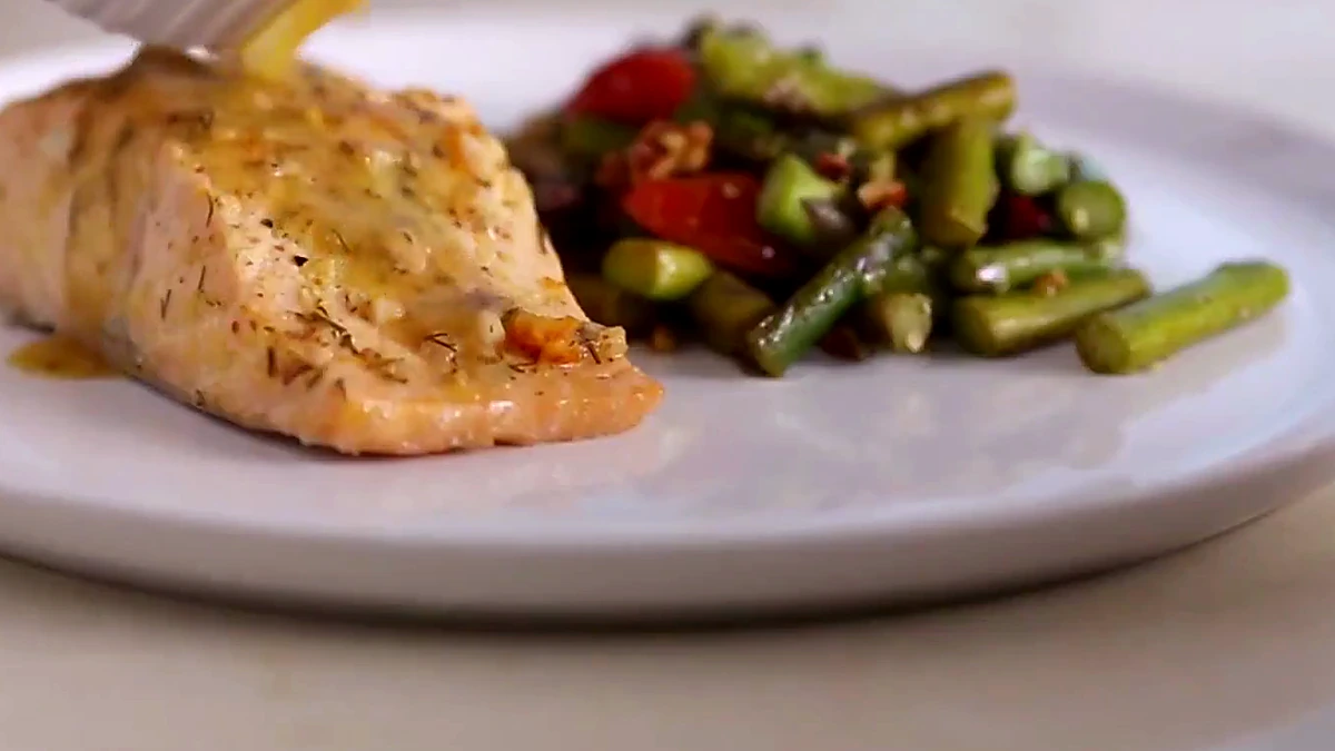 Close view of citrus sauce over salmon