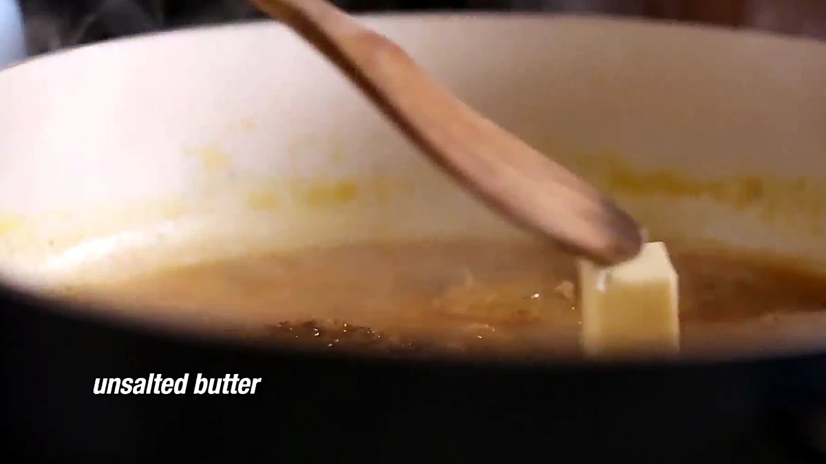Butter melting into the orange Dijon sauce