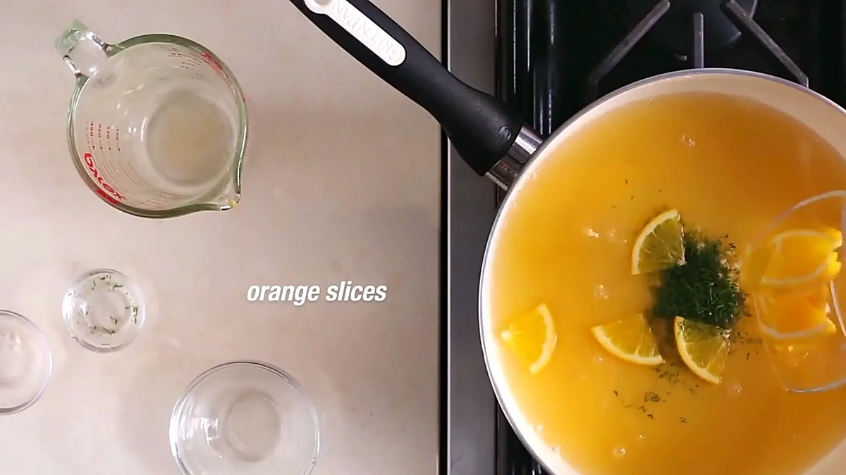 Fresh dill and orange slices in the pan