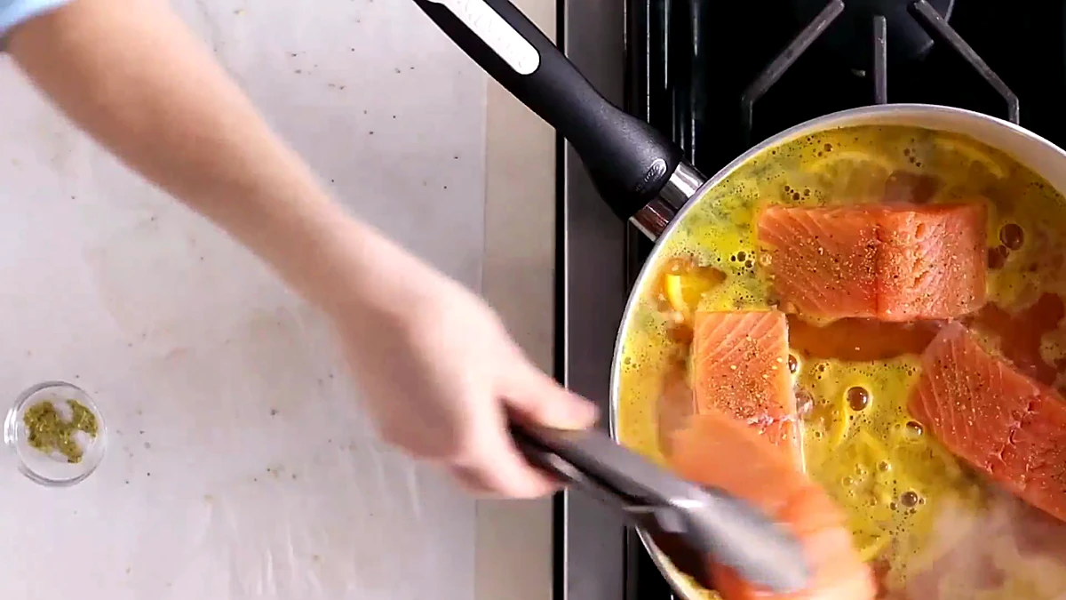 Salmon fillets added to citrus liquid