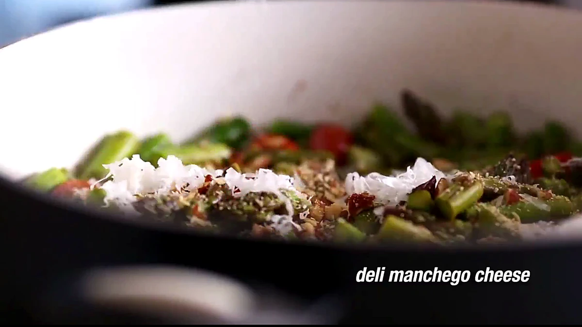 Manchego cheese added to the asparagus almond salad