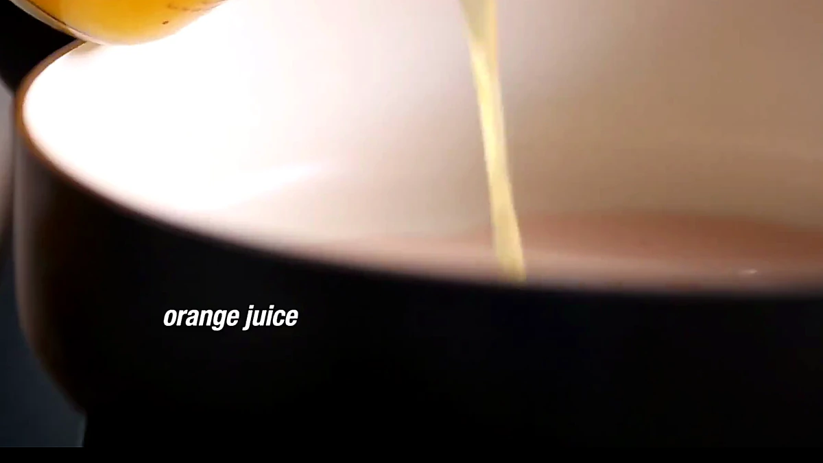 Orange juice added to the pan