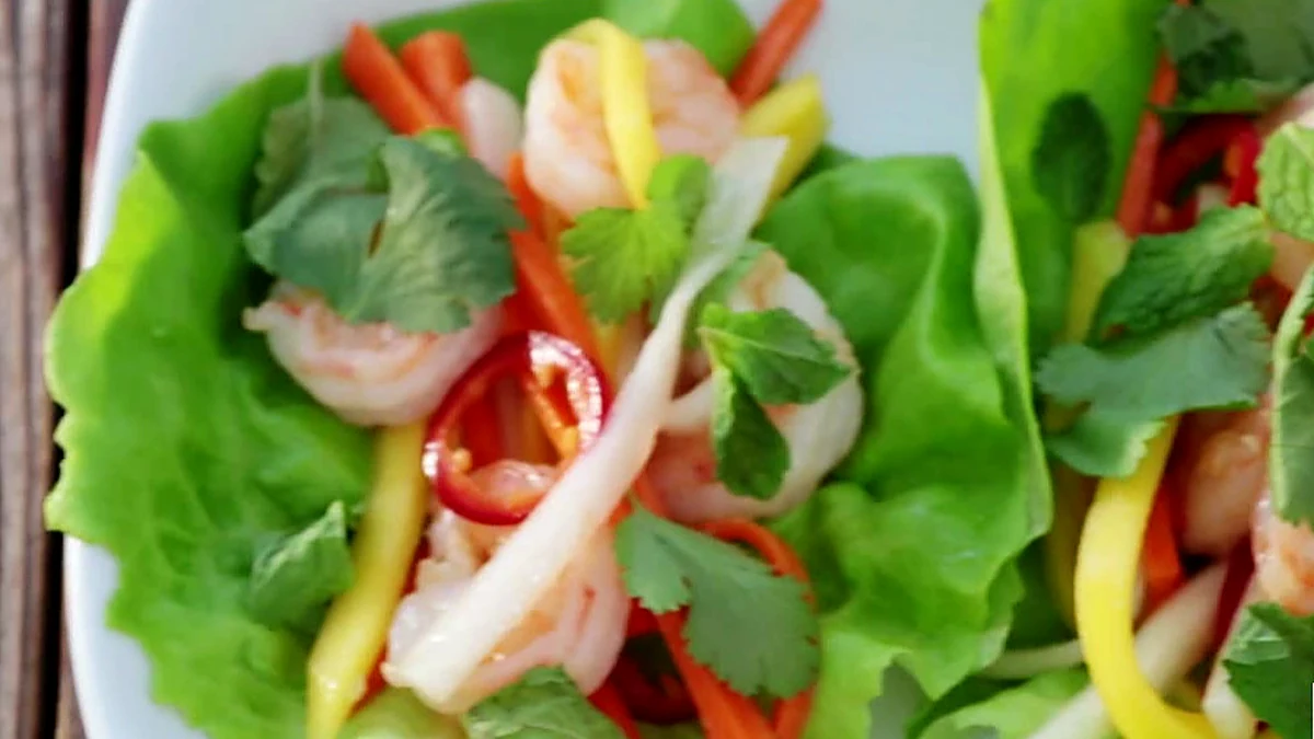 Mint and cilantro added to shrimp mango lettuce wraps