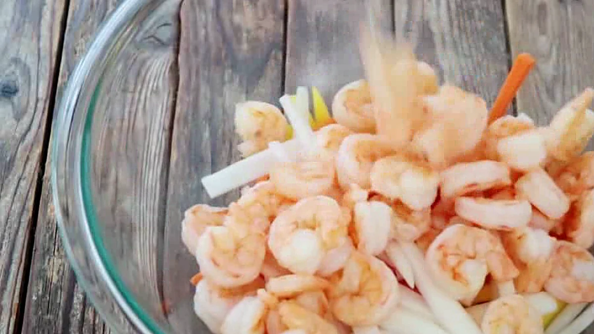 Cooked shrimp added to mango and vegetables