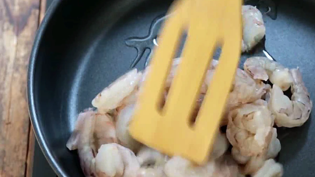 Shrimp cooking in a skillet