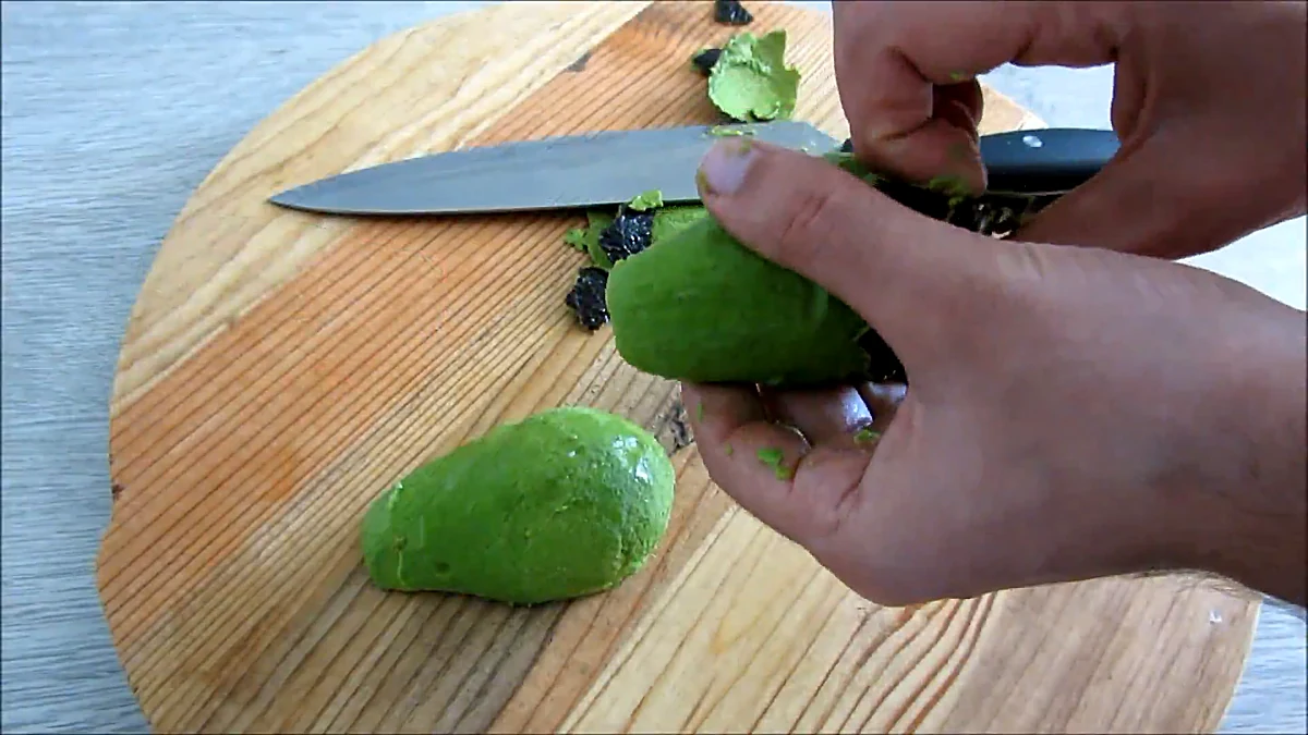 Avocado skin peeled away