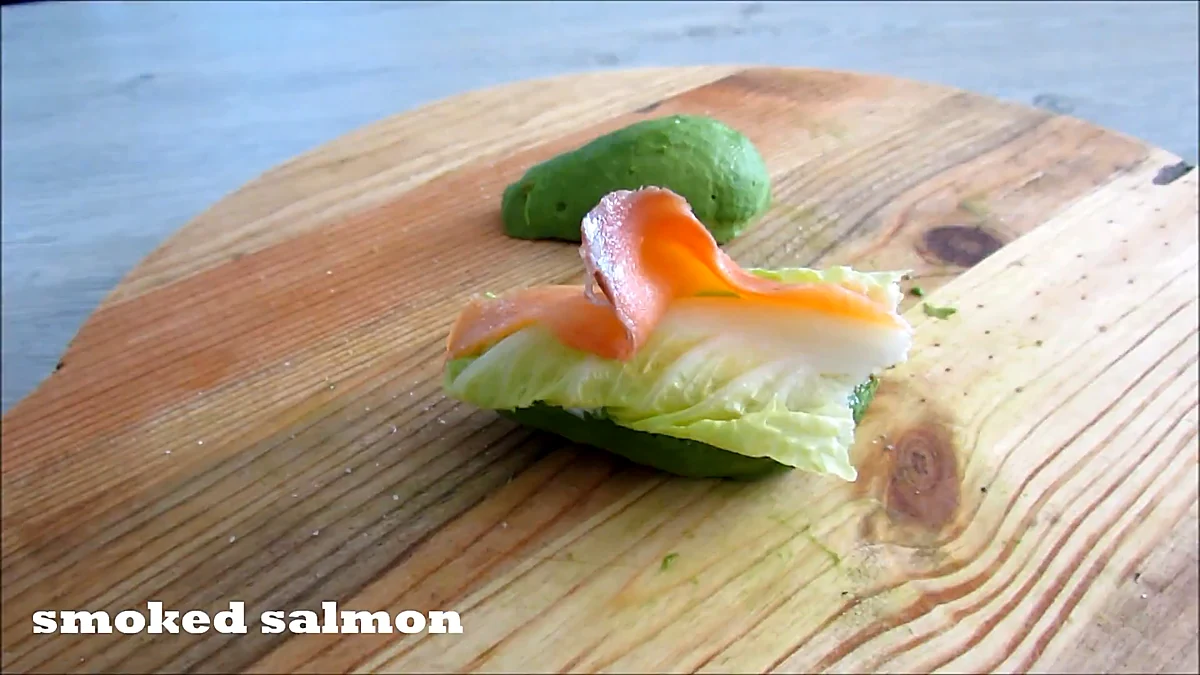 Avocado burger filling with lettuce and smoked salmon