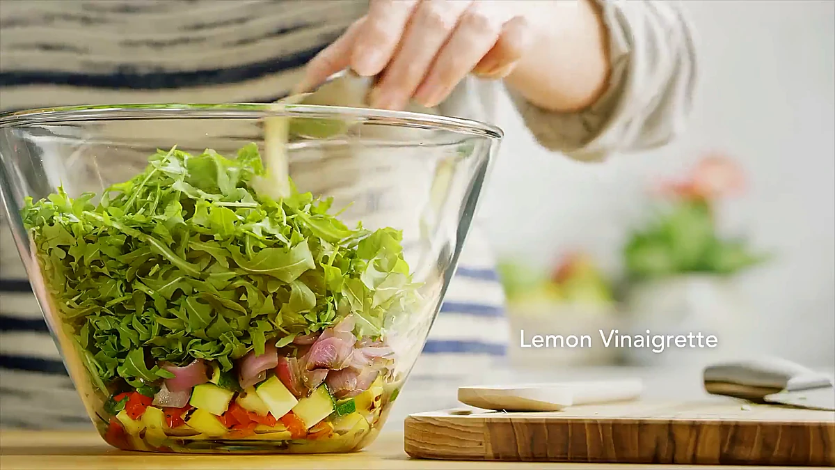 Lemon vinaigrette added to the grilled vegetable relish