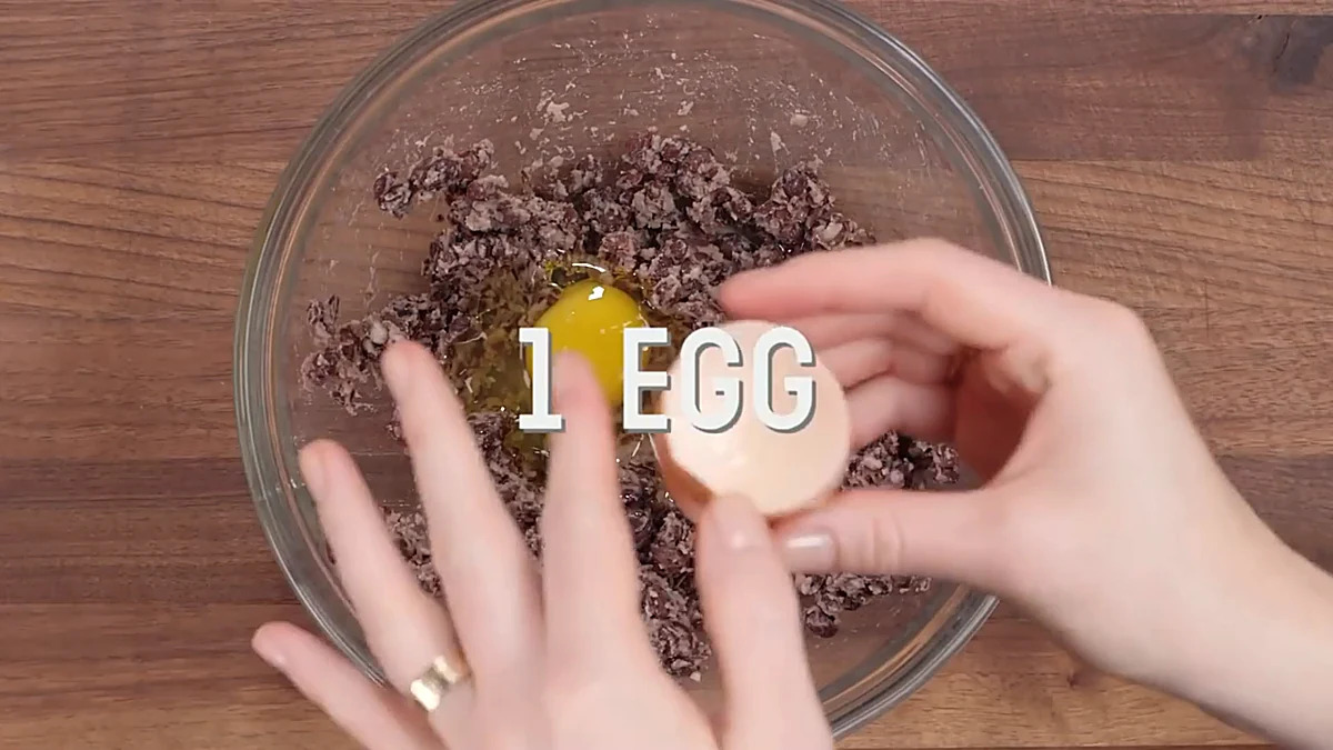 Egg added to mashed black beans