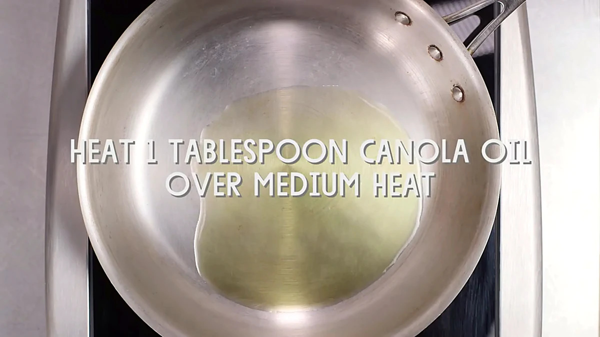 Canola oil heating in a skillet