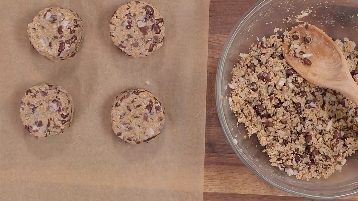 Six black bean burger portions on parchment