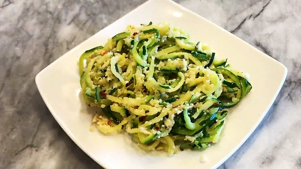 Finished garlic Parmesan zucchini noodles on a plate