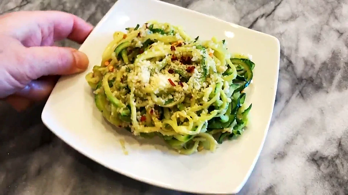 Cheesy garlicky zucchini noodles plated