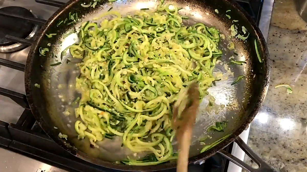 Cheesy zucchini noodles tossed in the skillet