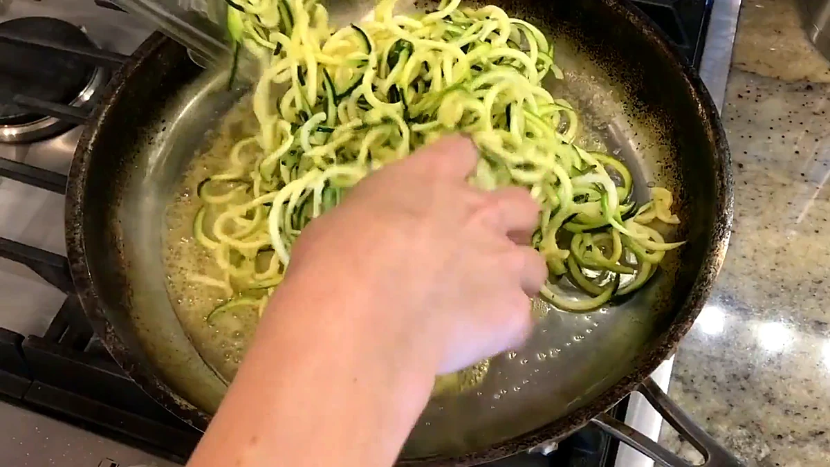Spiralized zucchini added to foaming butter