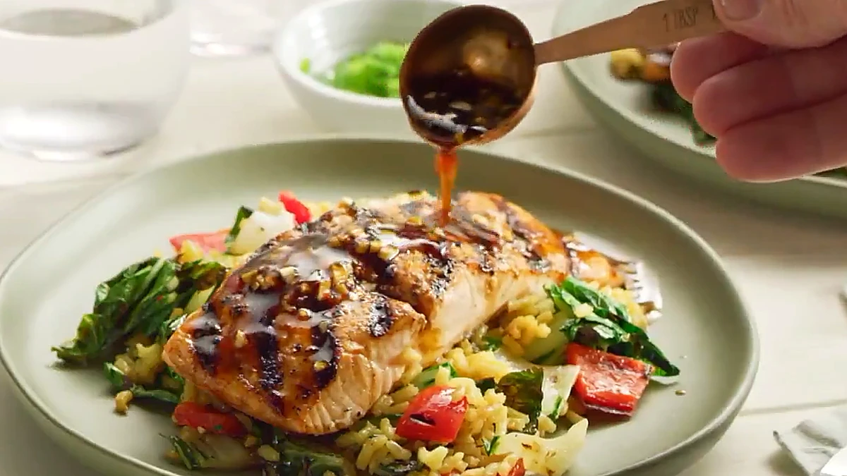 Citrus balsamic marinade drizzled over the grilled salmon and rice salad