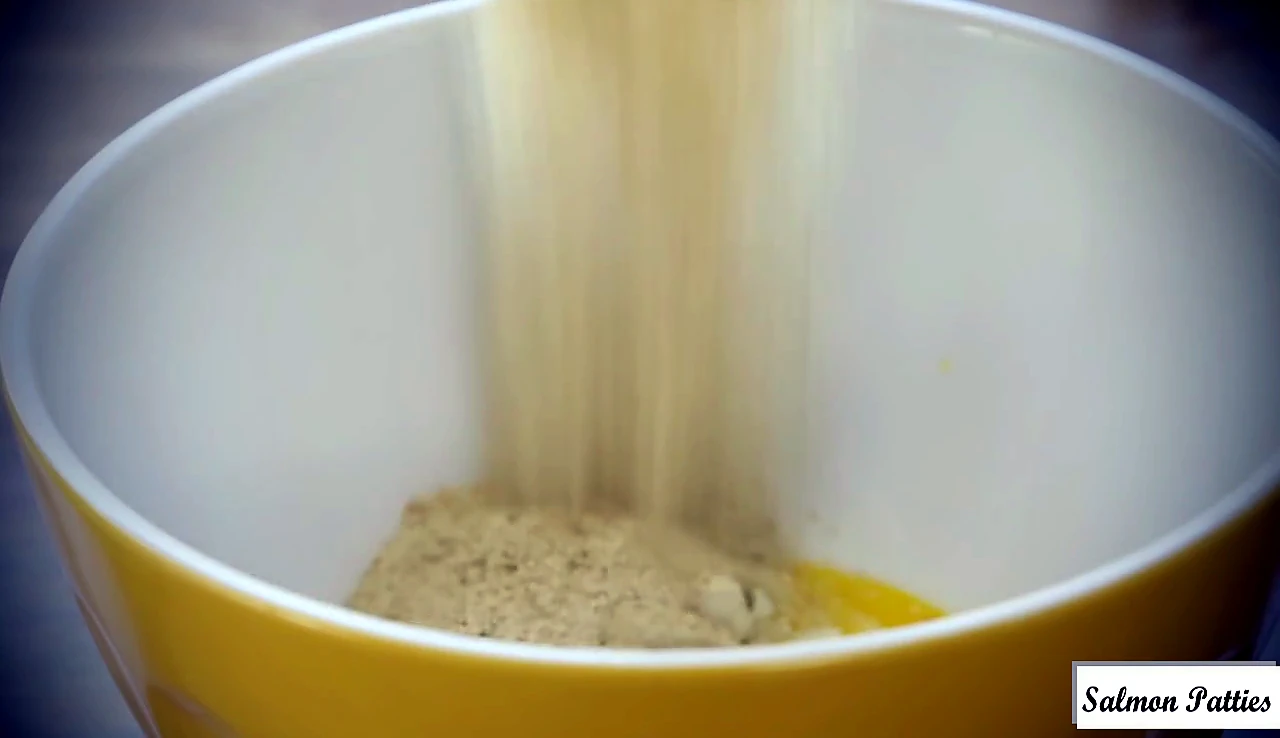 Seasoned breadcrumbs poured into the bowl