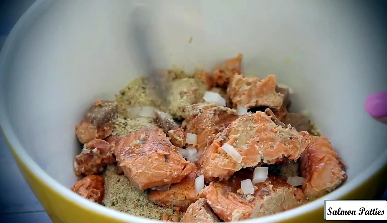 Canned salmon added to the mixing bowl