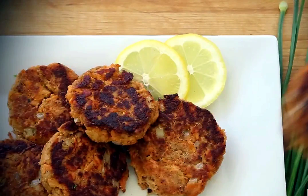 Finished salmon patties served with lemon