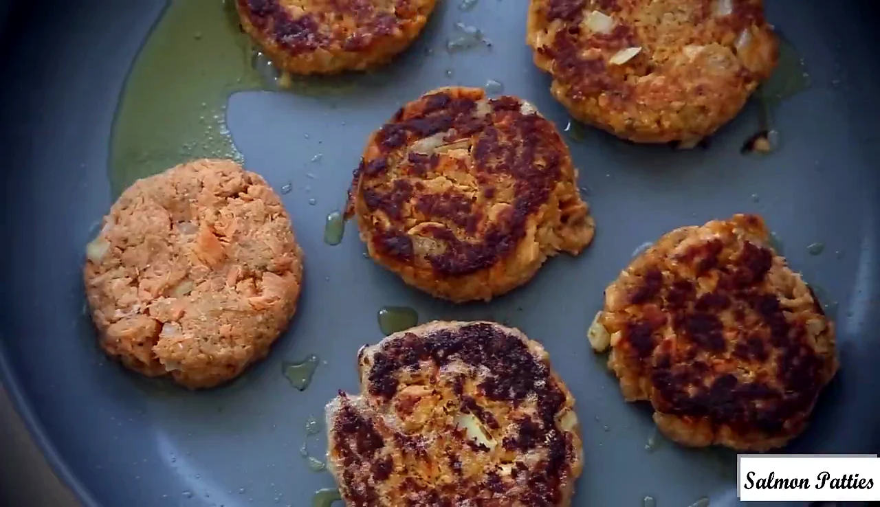 Salmon patty flipped to a browned side