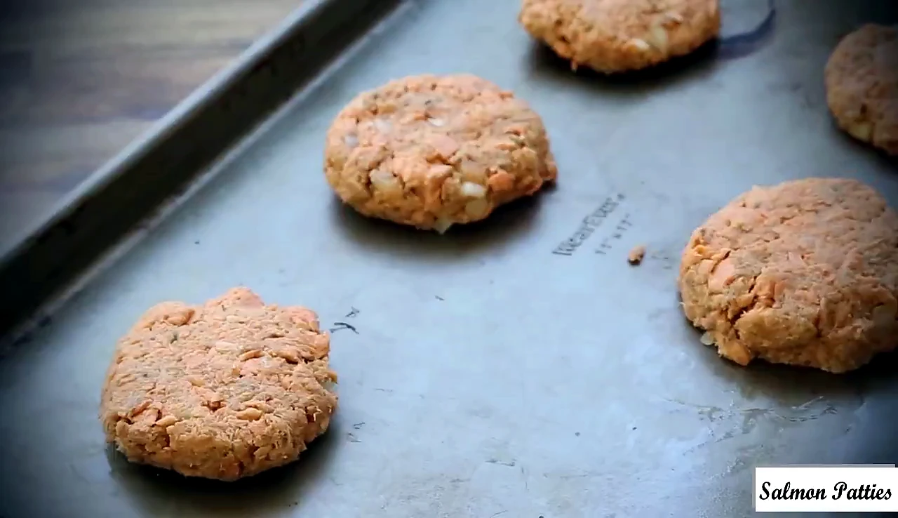 Shaped salmon patties on a pan