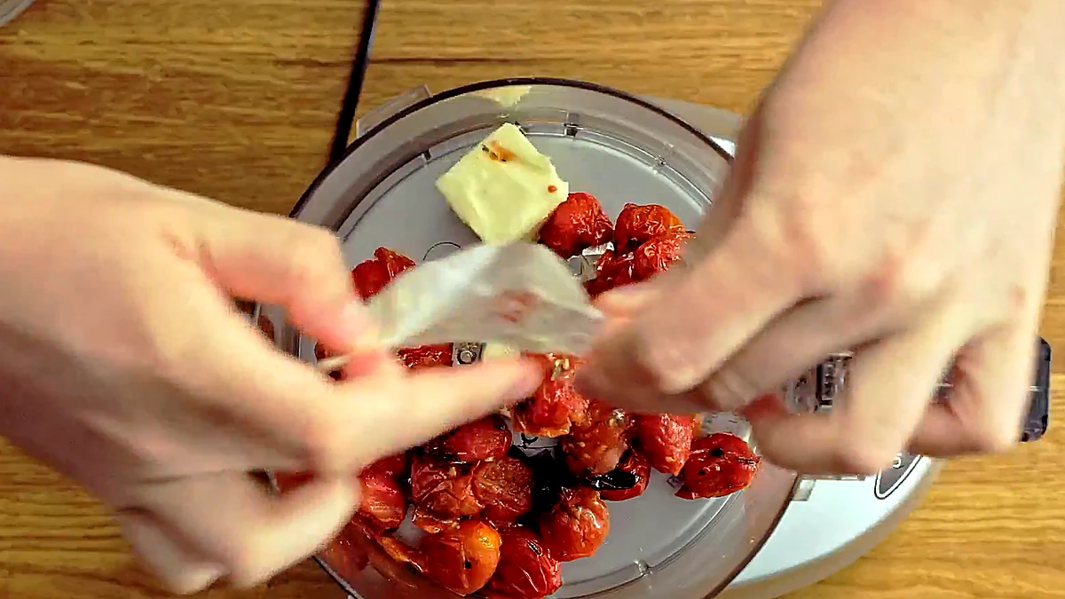 Roasted tomatoes and salted butter in a food processor for the sauce