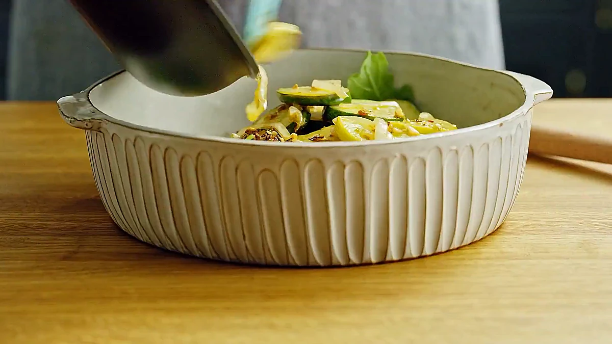 Warm zucchini and squash tossed with arugula and lemon dressing
