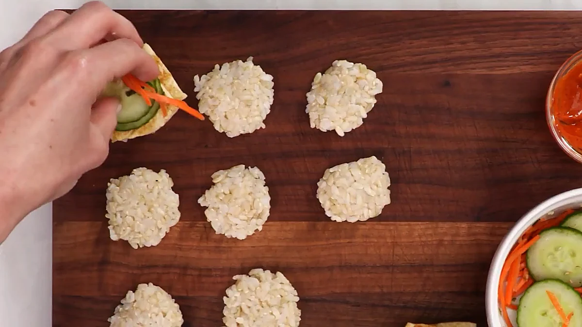 Cucumber and carrots added to sushi slider