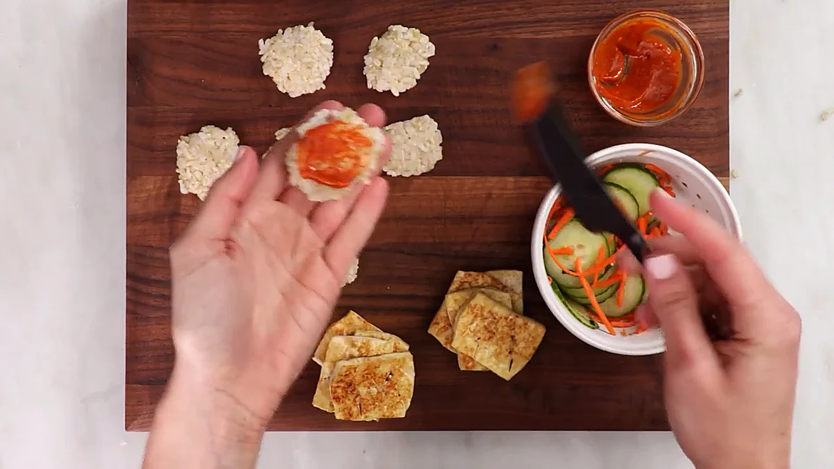Gochujang sauce spread on a rice bun