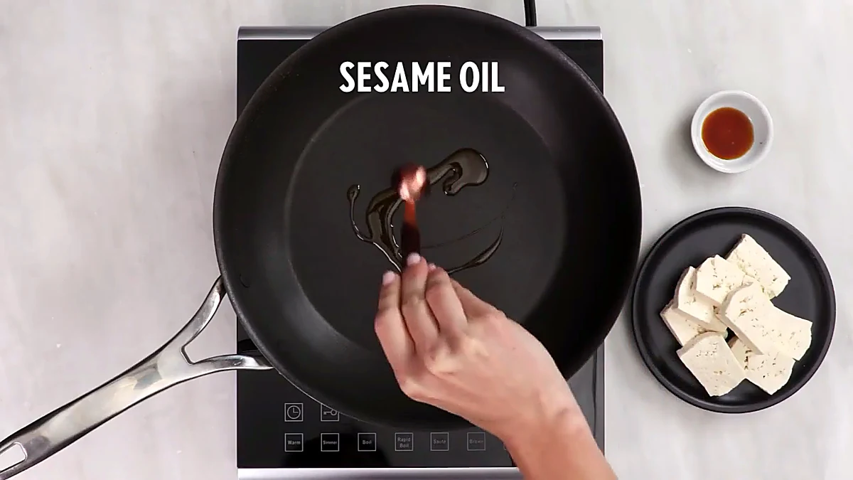 Sesame oil added to a skillet