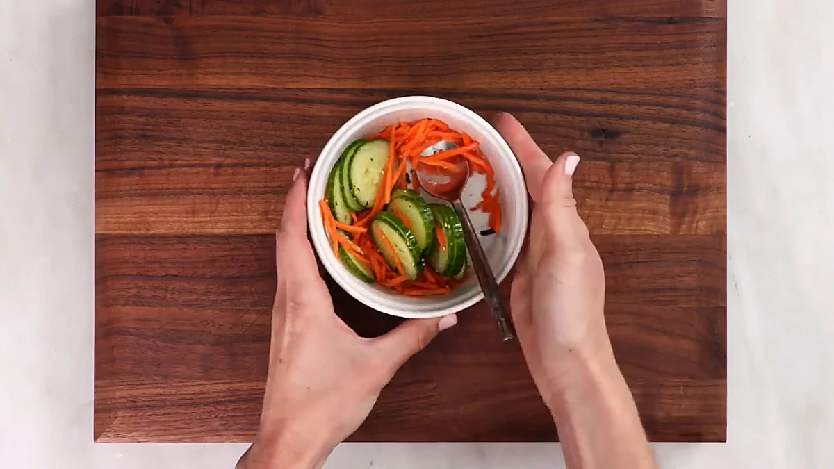 Cucumber and carrots tossed with seasoning
