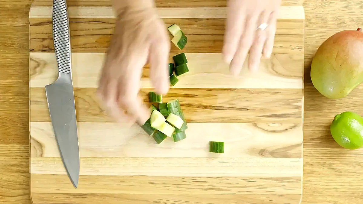 Cucumber diced on a cutting board