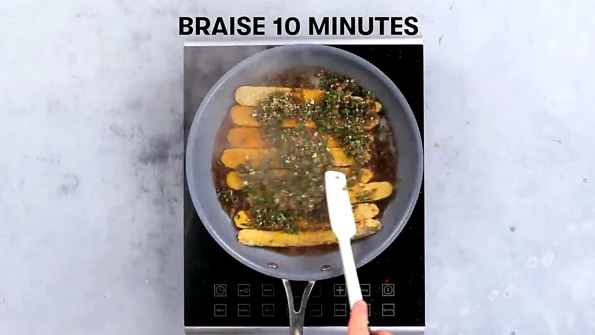 Tempeh braising in herb sauce