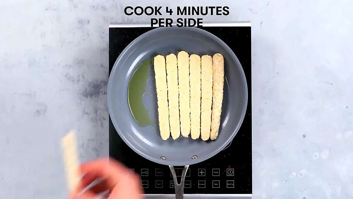 Tempeh strips added to the skillet
