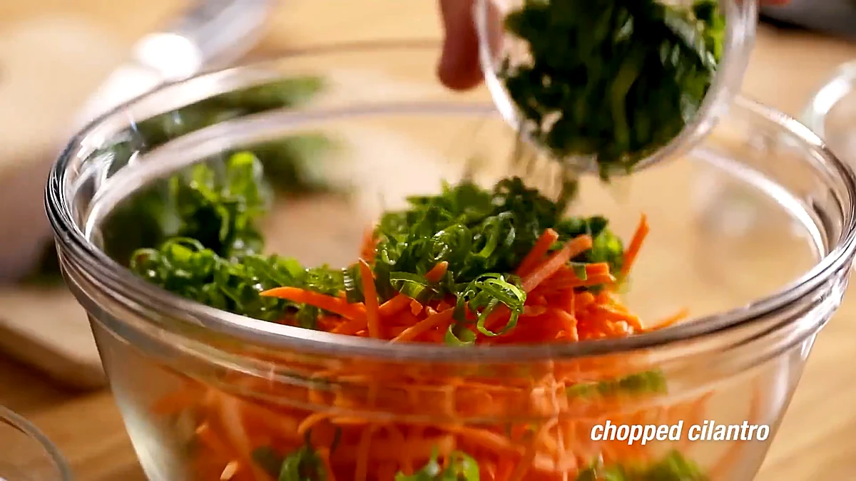 Green onions and cilantro added to carrots