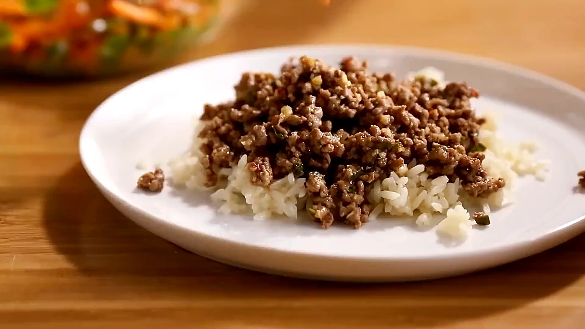 Ground beef spooned over jasmine rice