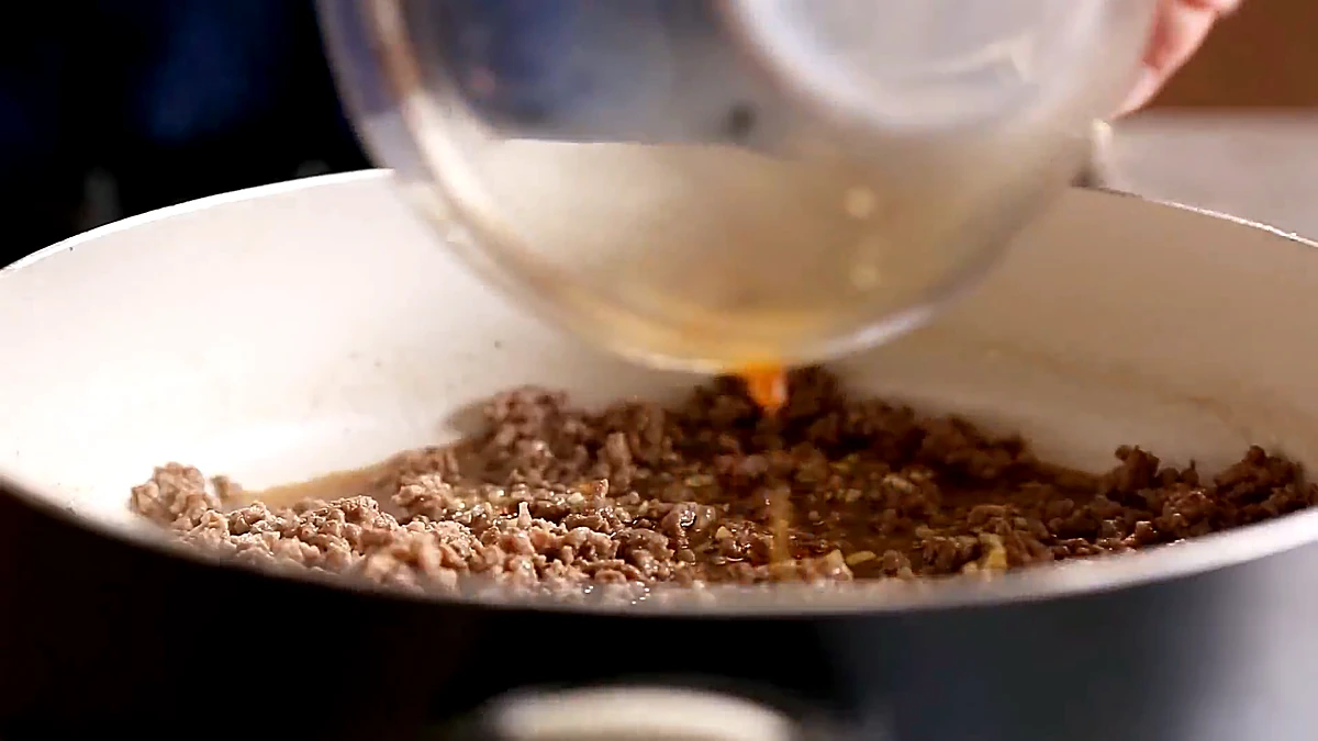 Sauce poured into cooked ground beef