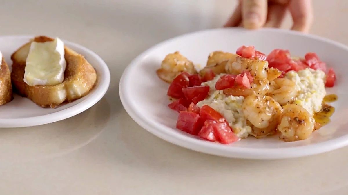 Tomato garlic shrimp over creamy corn with maple bread on the side