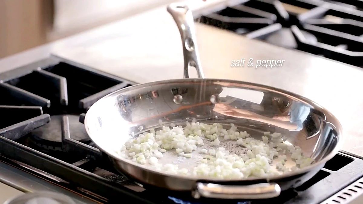 Diced onion cooking in butter in a skillet