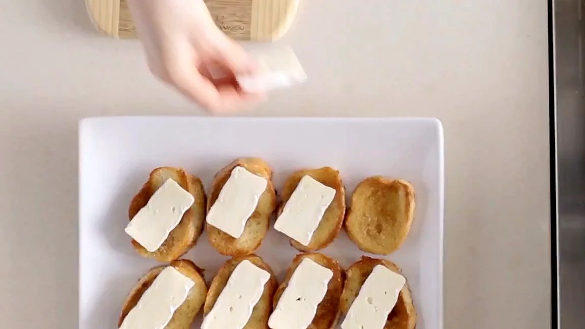 Toasted maple bread topped with pats of butter on a plate