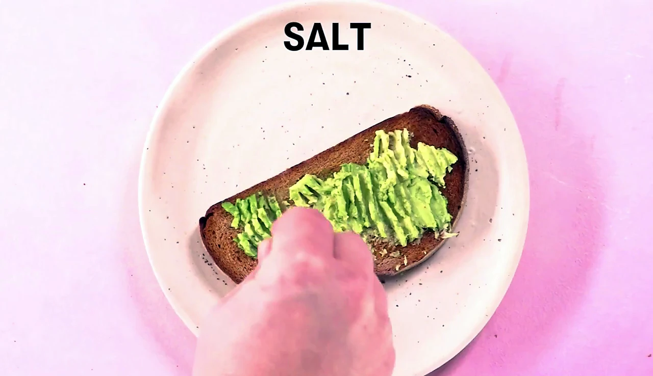 Salt added over mashed avocado