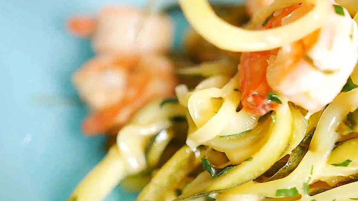 Close view of zucchini noodles with shrimp