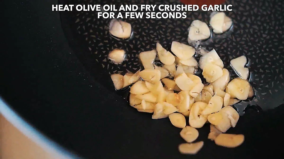 Crushed garlic frying in olive oil