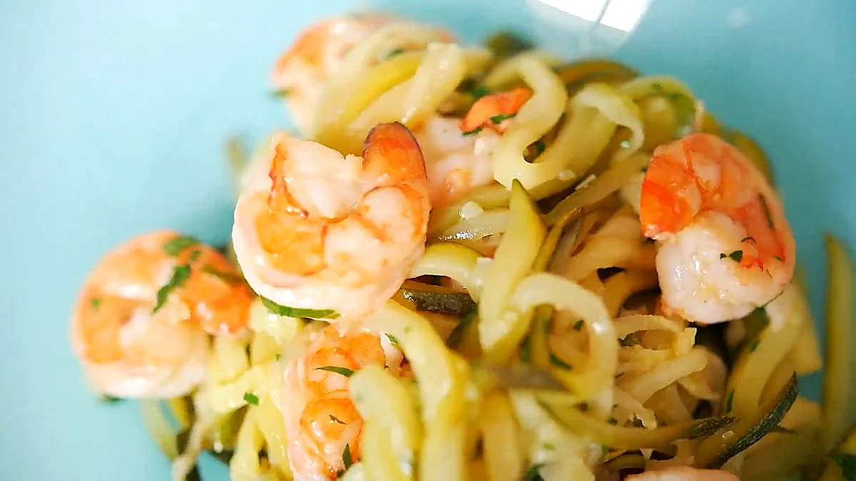 Zucchini noodles with shrimp plated in a bowl